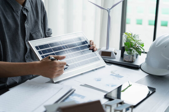 Electrical engineer working with solar panel sustainable energy concept