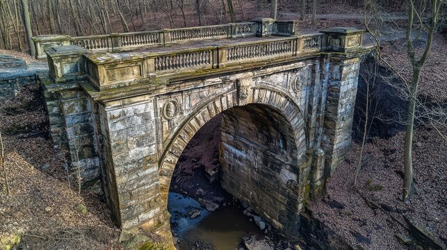 Bridge abutment details Victorian stone arch ornate balustrade carved medallions historic masonry craftsmanship weathered limestone natural woodland setting