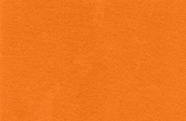Fototapeta premium Orange textured background with smooth appearance and vibrant color for contemporary graphic projects.