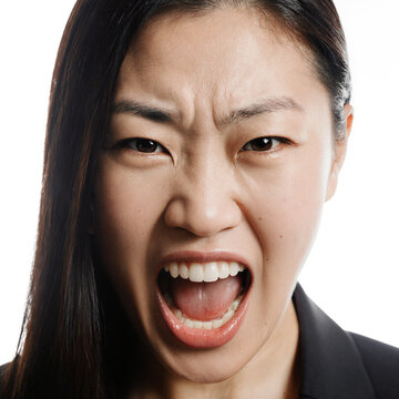 Woman shouting anger portrait of an angry Asian woman shouting or screaming in fury on a transparent background