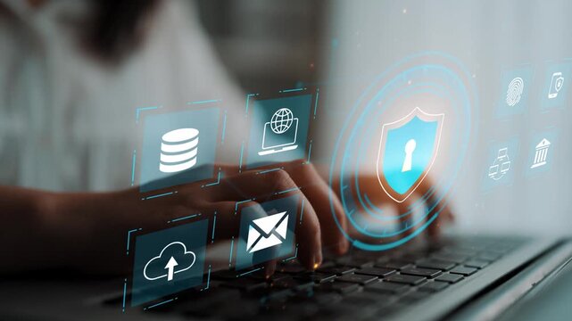 Hands typing on a laptop with floating security icons representing data protection, privacy, and digital information safety in a modern office environment Gluon.