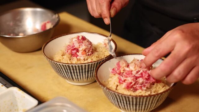 Japanese Sushi Chef Hands Carefully Preparing Raw Tuna and Crab Seafood Bowls