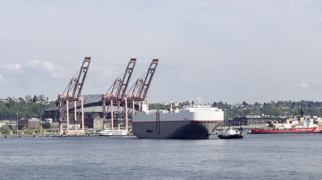 Roll-On Roll-Off Cargo Ship Leaving Seattle with Coast Guard