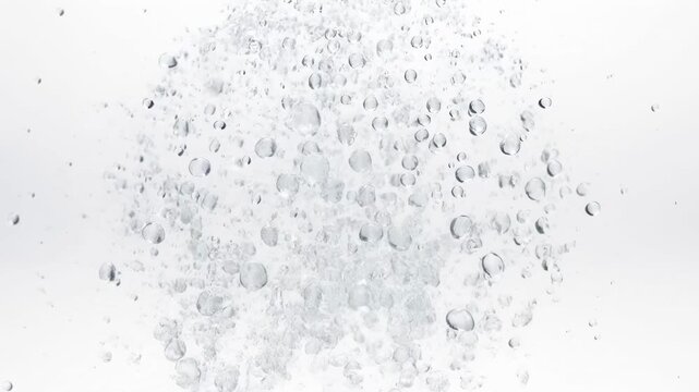Water balloon bursting in ultra slow motion, droplets suspended mid air