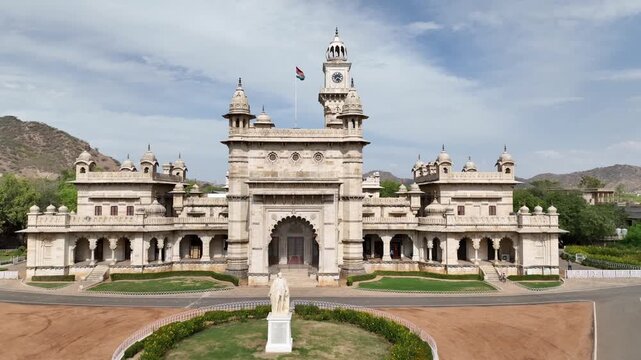 Mayo College heritage building with Lord Mayo statue reveals the Aravalli hills landscape in Ajmer, Rajasthan, Drone shot