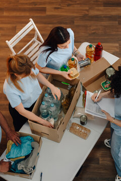 Volunteers sorting donations for community food bank