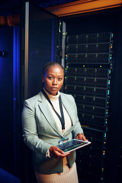 Portrait, programming and black woman in server room, tablet for software upgrade and cyber security. African person, engineering and programmer in workplace, connection or tech for online protection