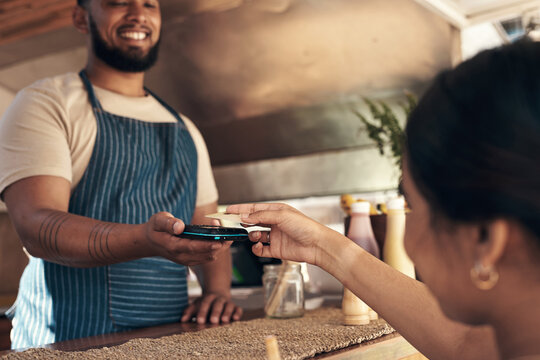 Customer, server and hands with credit card by food truck, electronic money transfer and pos machine. NFC transaction, waiter or woman with fintech for digital order payment, smile or bill settlement