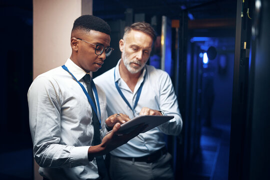 Review, engineer or people with tablet in server room, system backup process or cybersecurity update. Reading, firewall test or men with plan for mainframe protection, tech or data center maintenance