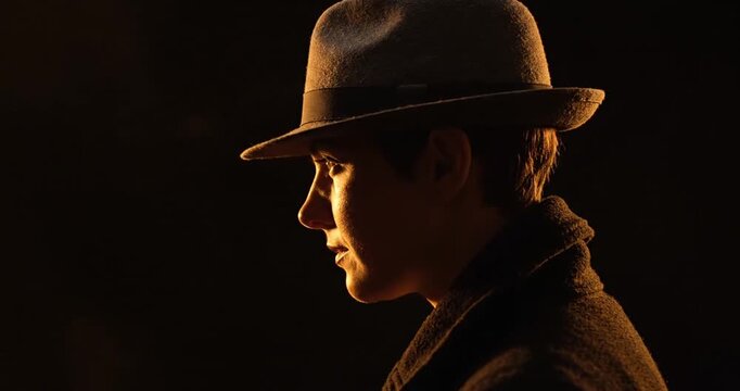 Man wearing brown hat and coat.