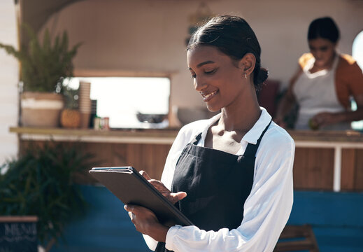 Happy woman, hostess and outdoor restaurant with tablet for schedule booking or reservation. Female person, waitress or smile with technology or app for online order, hospitality or catering service