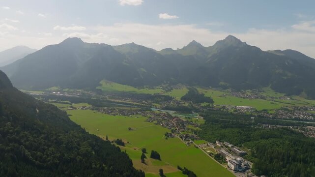 Aerial panorama of Reutte with alpine mountains ridges valleys and Ehrenberg Castle with Highline 179 bridge tourism in Europe