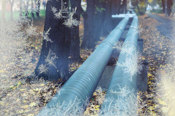 Fototapeta premium Winter gas pipeline. Metal pipes on the street. pipes from the pipeline. heat-pipe.