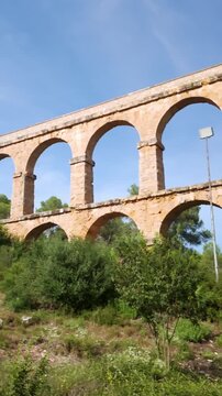 Roman aqueduct of Tarragona standing under blue sky