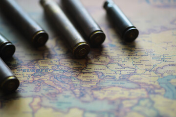 Naklejka premium Bullets on Europe Map - Concept of Conflict, War, and Geopolitical Tensions