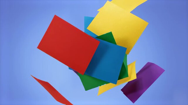 A creative 3D graphic illustration featuring a scattering of vibrant colored square paper sticky notes&mdash;including red, yellow, green, and blue&mdash;floating dynamically over a light blue studio backdrop. Ta