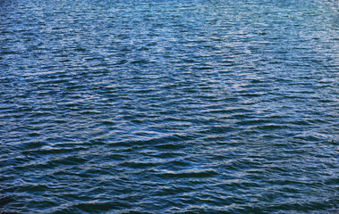 Fototapeta premium Water surface. The texture of the water. Waves on the lake in windy weather.