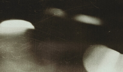Fototapeta premium Old film texture with scratches, noise and light leaks. Realistic transparent overlay film texture in black-white, dust and grain. Distressed retro movie or photo negative effect of cinema nostalgia