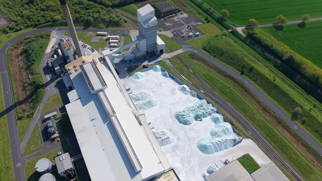 Aerial view of Guardian Glass Production Factory with raw material piles and industrial buildings in Goole, England, United Kingdom.