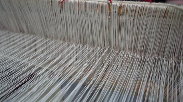 Close up of multicolored thread spools and yarn rolls for professional garment production and crafts