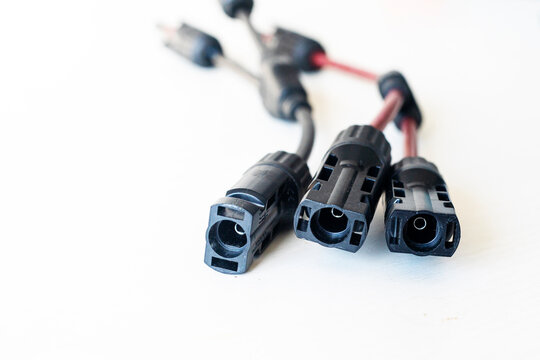 Close-up of 2Y/3Y/4Y solar connectors for parallel connection, 30A, 1000V, photovoltaic sockets for solar panel cables, 2 pcs on the table