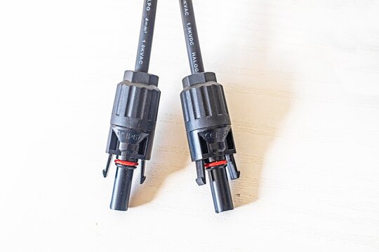 Close-up of 2Y/3Y/4Y solar connectors for parallel connection, 30A, 1000V, photovoltaic sockets for solar panel cables, 2 pcs on the table