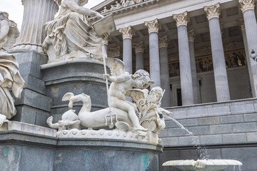 Obraz premium Detailed view of marble sculptures at the Pallas Athene Fountain and Austrian Parliament