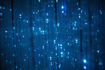 Dark blue abstract virtual background with a dense network of shimmering, light-emitting strands...