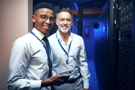 Portrait, storage and tablet with men in server room together for problem solving or solution. App, collaboration and cybersecurity with happy people in data center for engineering or IT support