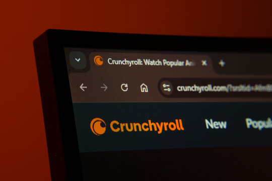 Dhaka, Bangladesh- 02 June 2025: Close-up of a computer screen displaying the Crunchyroll web interface in dark mode