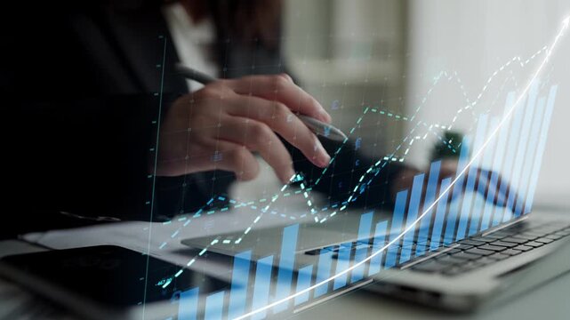 A business professional engages with data on a laptop, visualizing trends and growth through digital graphs, illustrating the importance of analytics in corporate strategy. Copula