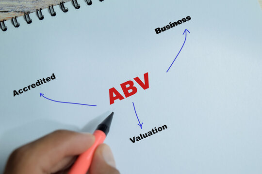 Concept of ABV - Accredited Business Valuation write on book isolated on Wooden Table