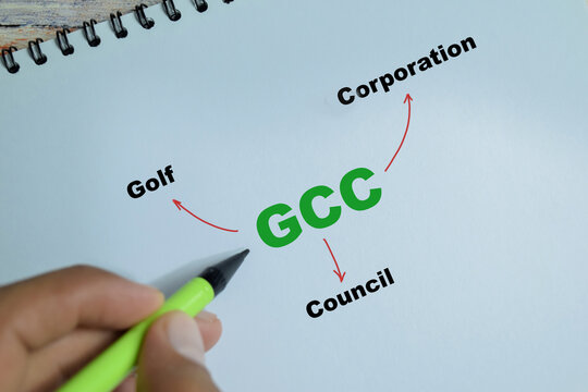 Concept of GCC - Golf Corporation Council write on book isolated on Wooden Table
