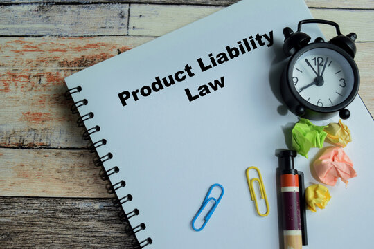 Concept of product liability law write on book isolated on Wooden Table
