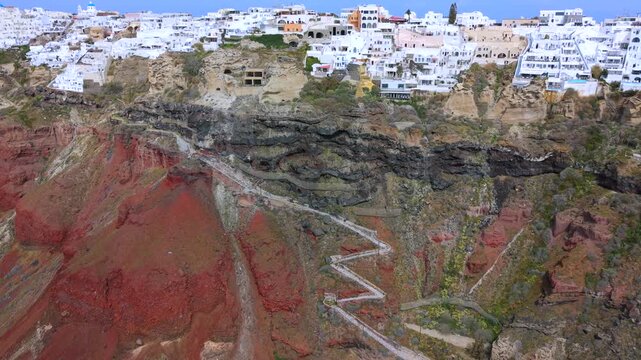 Aerial Video of Oia Cliffs, Zigzag Path, and Armeni Bay in Santorini. 