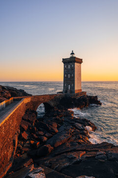 Petit Minou lighthouse on Atlantic Ocean coast at sunset in France
