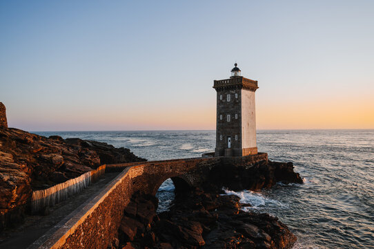 Petit Minou lighthouse on Atlantic Ocean coast at sunset in France