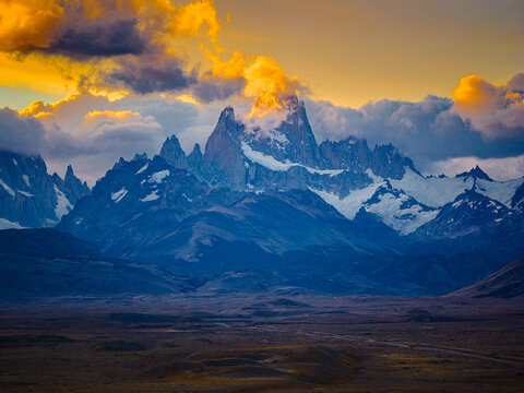 Fitz Roy peaks glowing in fiery sunset clouds, Patagonia Argentina