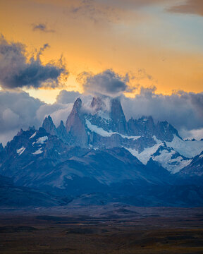 Fitz Roy peaks glowing in fiery sunset clouds, Patagonia Argentina