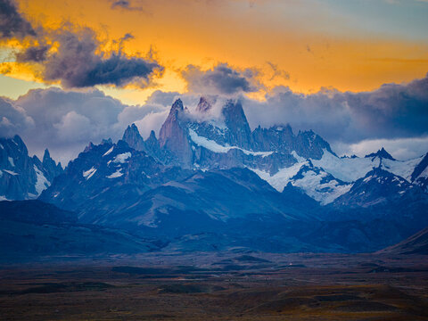 Fitz Roy peaks glowing in fiery sunset clouds, Patagonia Argentina