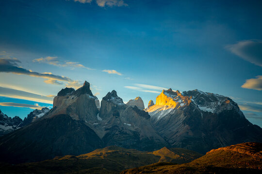 Cuernos del Paine peaks glowing in golden sunset light, Vhile