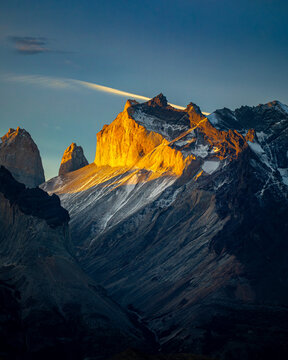 Cuernos del Paine peak glowing in golden alpenglow, Chile