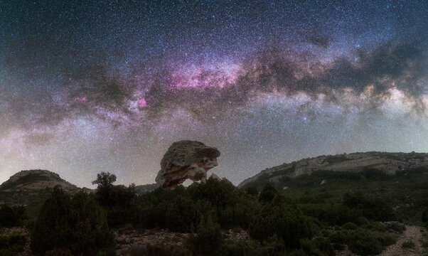 Night Landscape with Milky Way Above Natural Rock Arch Formation
