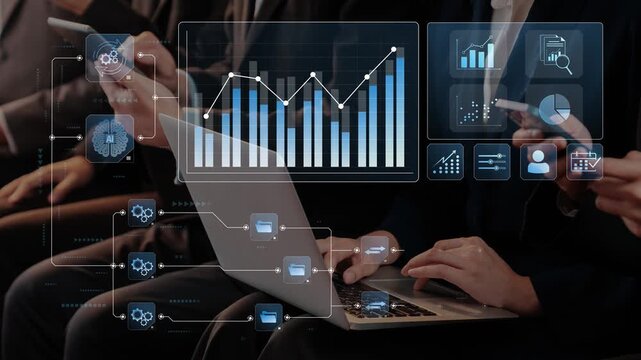 Modern business professionals analyze data trends using laptops and mobile devices in a collaborative office setting. Focus on analytics and teamwork. Raster