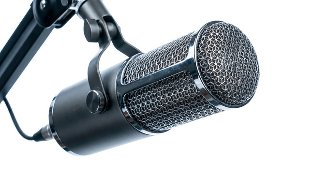 Professional black studio broadcast microphone hanging on metal boom arm isolated over white background representing modern podcast radio audio recording equipment concept