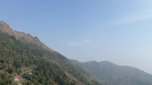 Scenic landscape view of lush green hills n misty mountains on the road to Darjeeling, West Bengal.