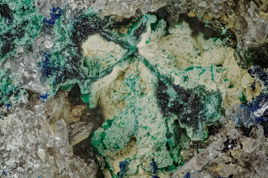 Detailed micro photography of tabular azurite and green malachite. Diverse crystal forms on quartz matrix from Altai, Russia. Mineralogy sample