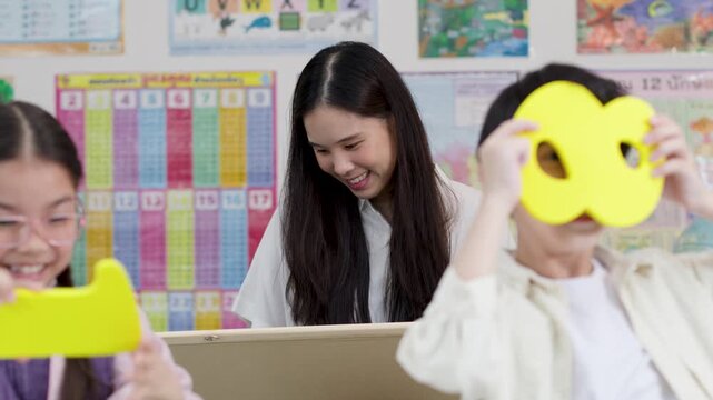Thai Teacher and Elementary Students Learning Mathematics with Chalkboard and Numbers