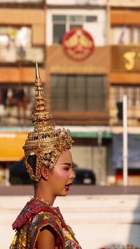 Traditional Thai Khon Dancer Performs in Ornate Costume at Wat Suthat