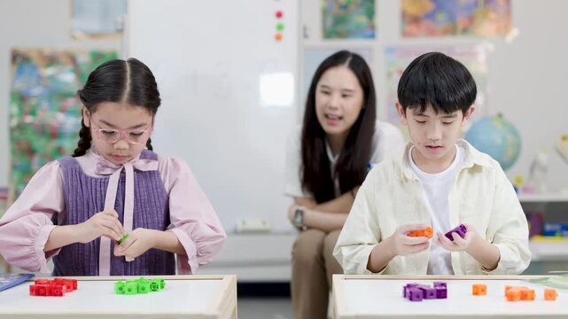 Asian Elementary Students Learning Mathematics with Colorful Blocks and Teacher